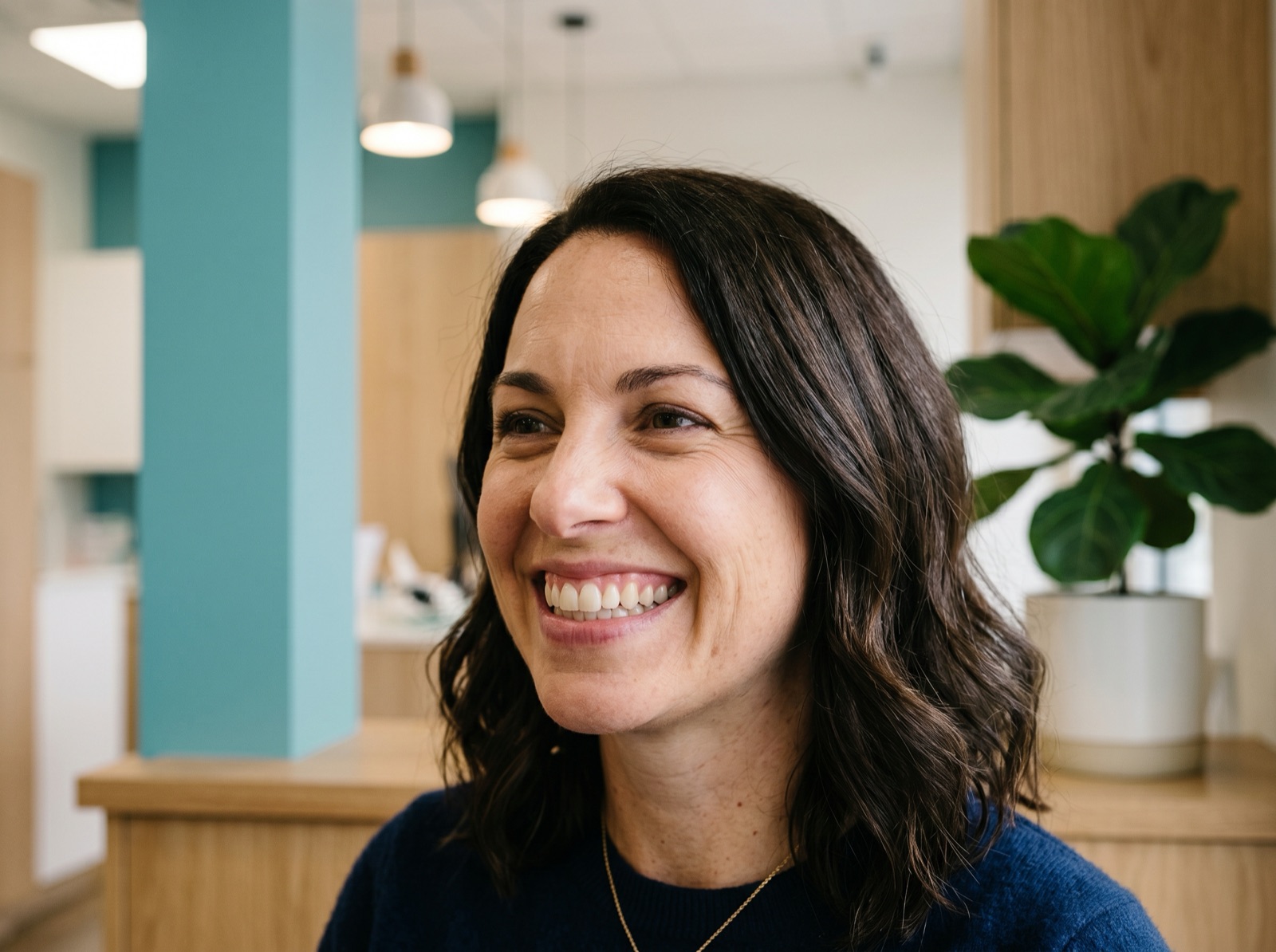 A healthy adult smiling with restored, healthy-looking gums